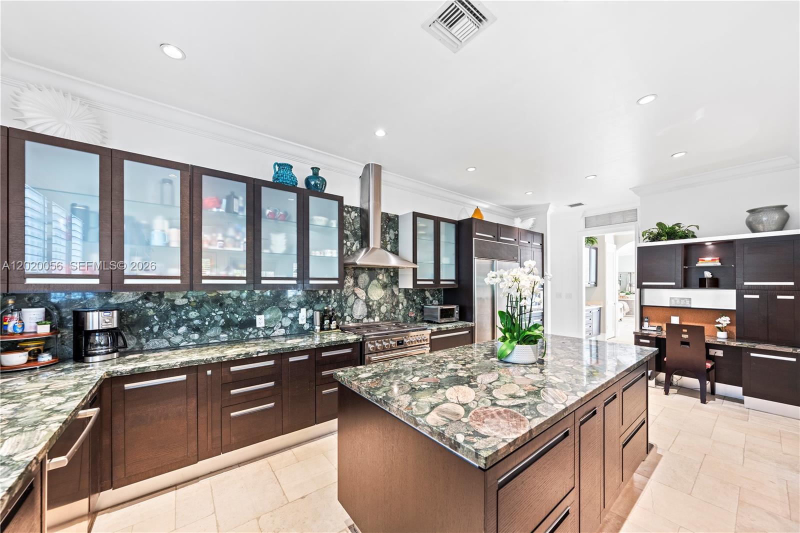 4196 Douglas Road Miami, FL 33133 - Photo 31 of 96 a kitchen with stainless steel appliances granite countertop a stove and a sink