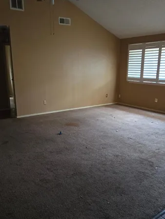 an empty room with a empty space and window