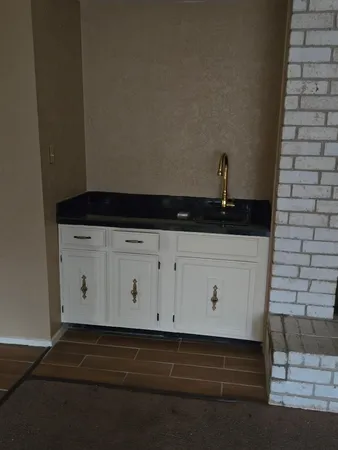 a view of living room with furniture and a flat screen tv