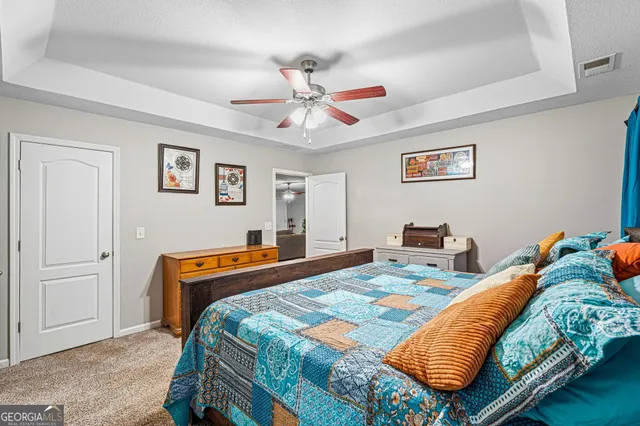 a bedroom with bed and window