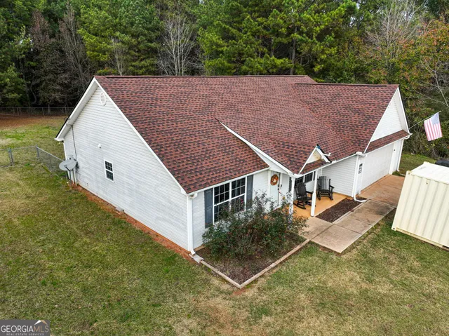 a aerial view of a house with backyard