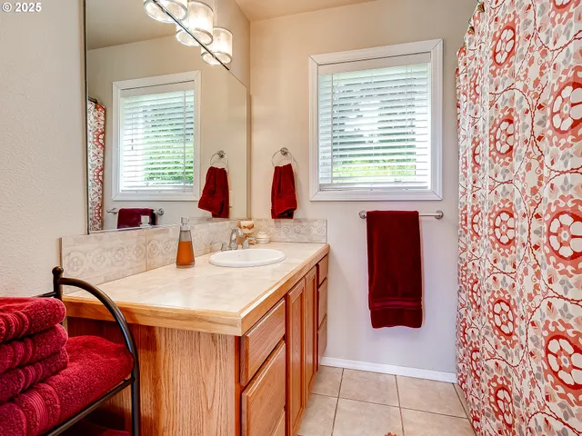 a dining hall with stainless steel appliances granite countertop a sink and a window