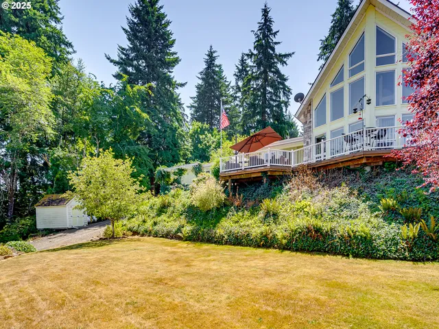 a view of a house with a garden and pathway