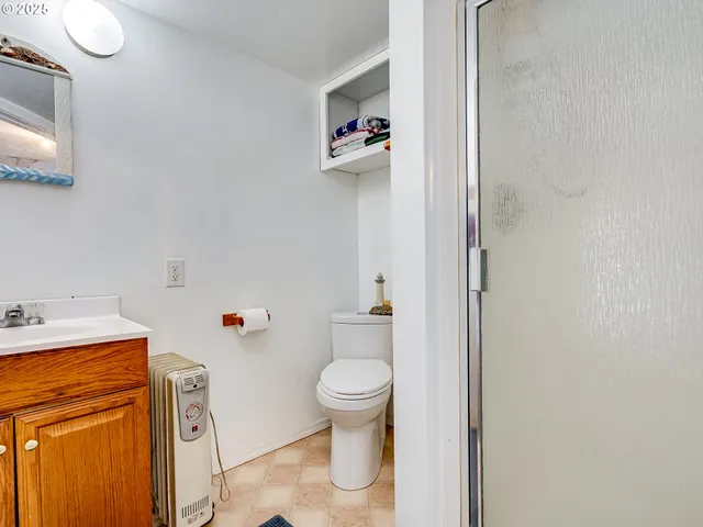 a white toilet sitting next to a bathroom sink