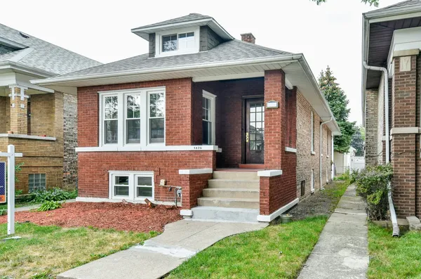 a front view of a house with yard