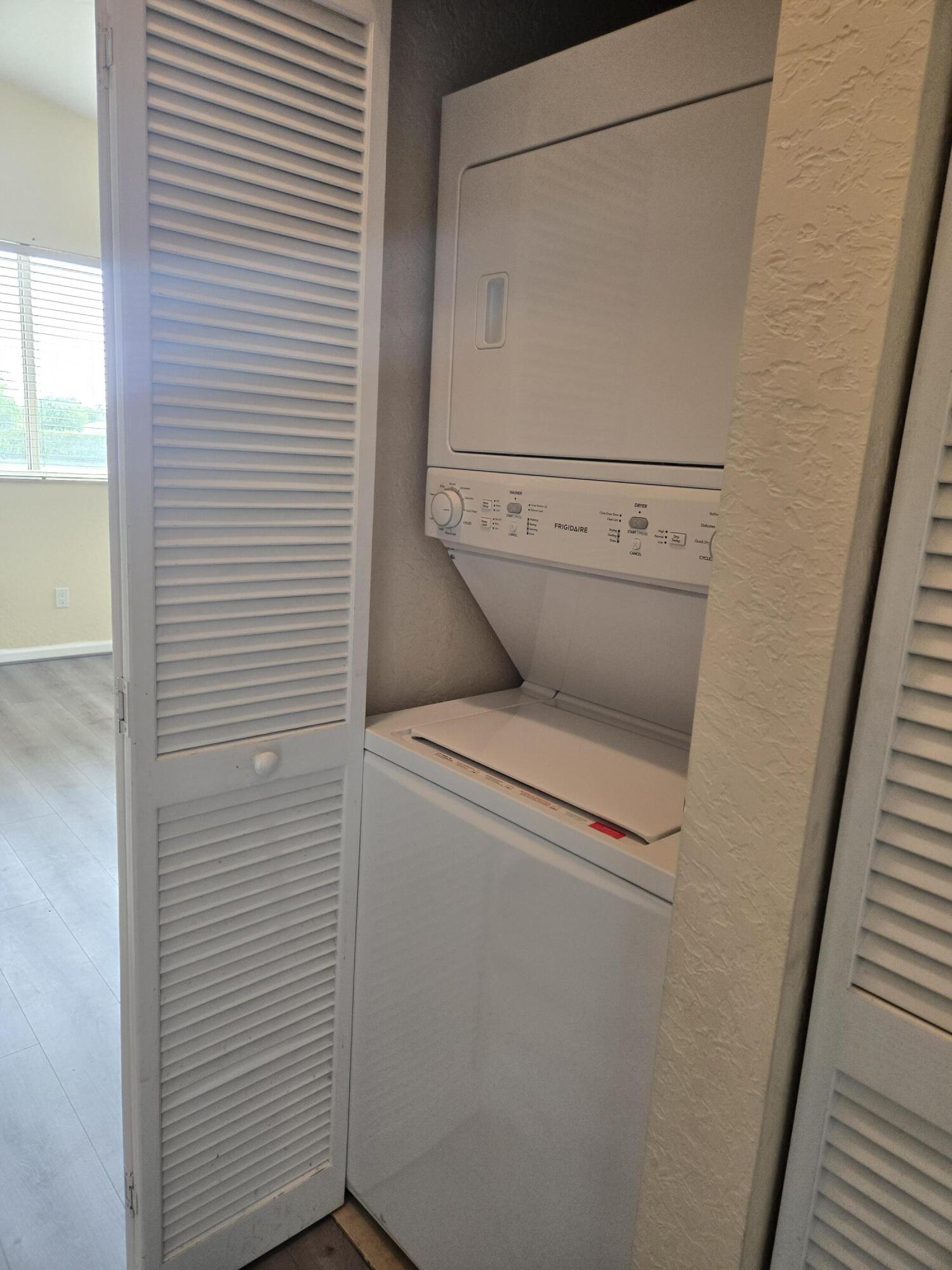 3141 Laurel Ridge Circle Riviera Beach, FL 33404 - Photo 15 of 16 a utility room with dryer and washer