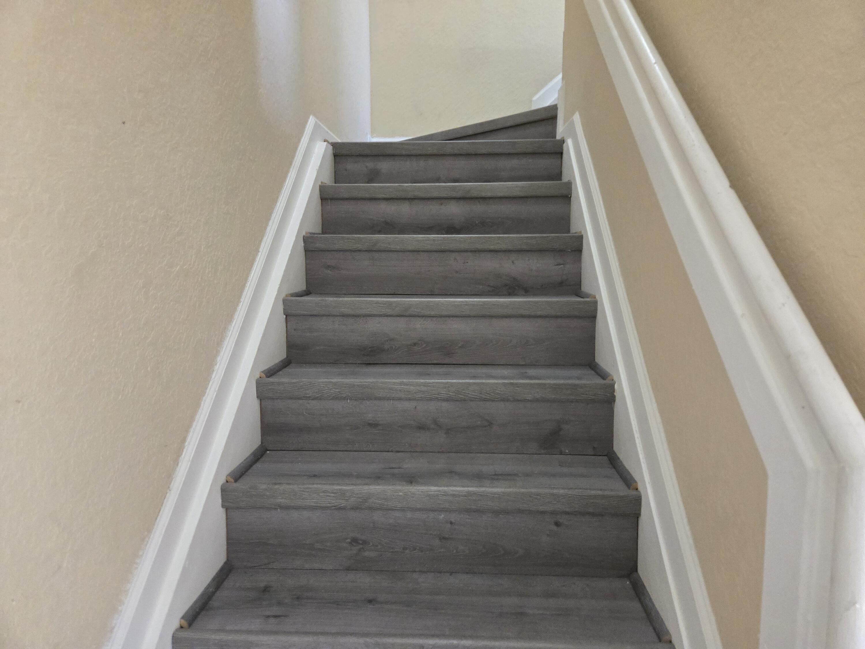 3141 Laurel Ridge Circle Riviera Beach, FL 33404 - Photo 5 of 16 a view of staircase with white walls