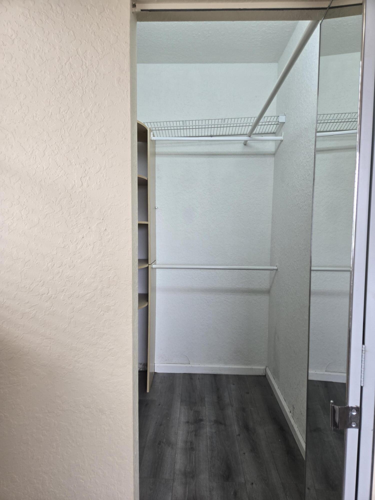 3141 Laurel Ridge Circle Riviera Beach, FL 33404 - Photo 9 of 16 a view of an empty walk in closet