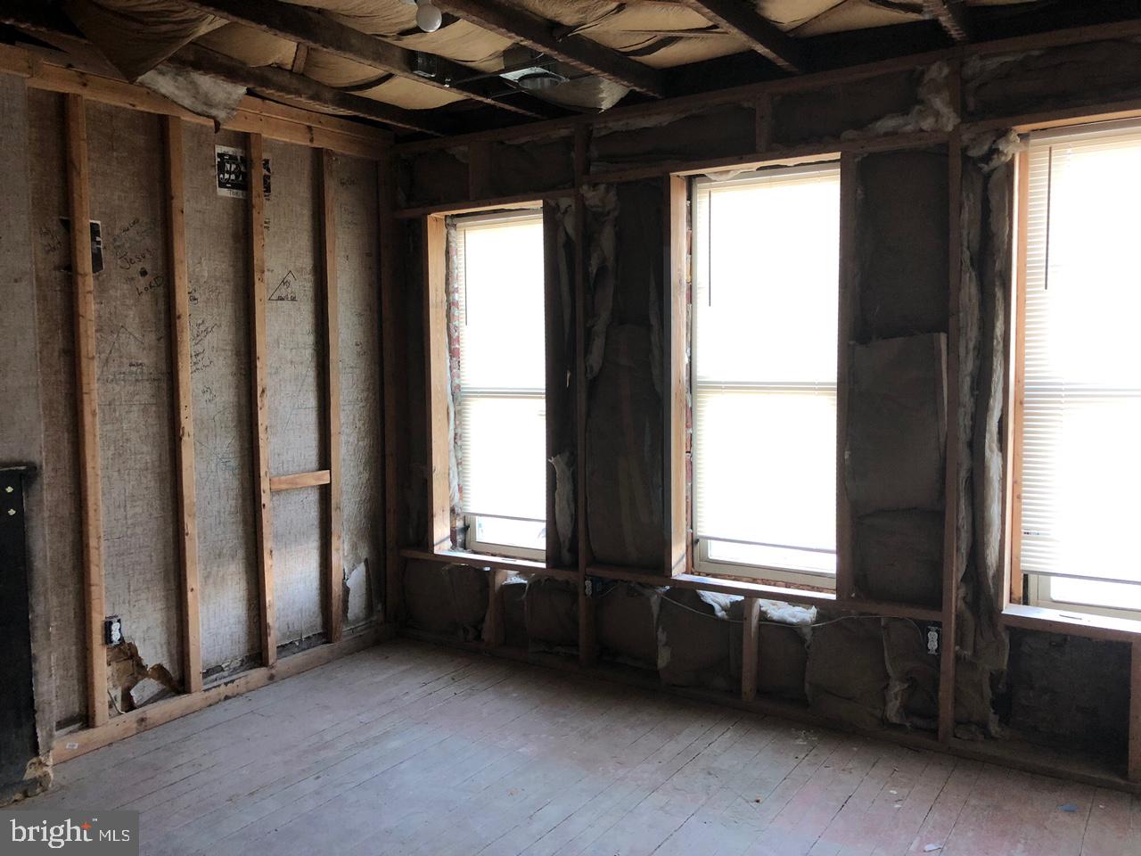 20 North Gilmor Street Baltimore, MD 21223 - Photo 12 of 15 a view of an empty room with a window