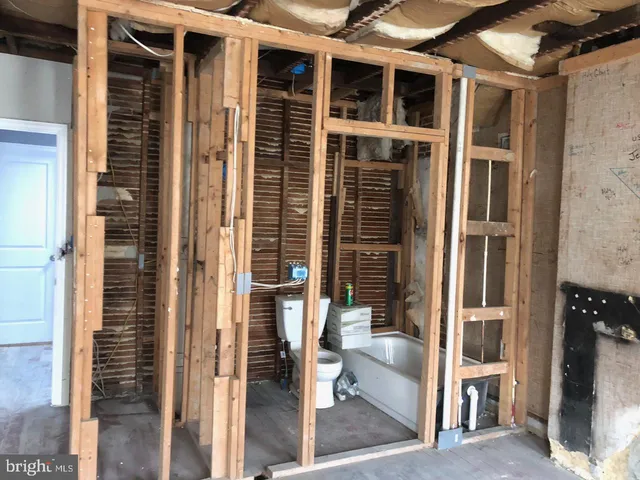 a bathroom with shower and bathtub