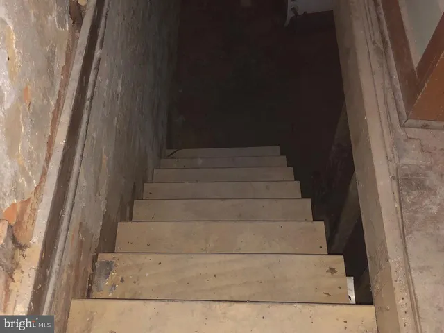 a view of staircase with white walls