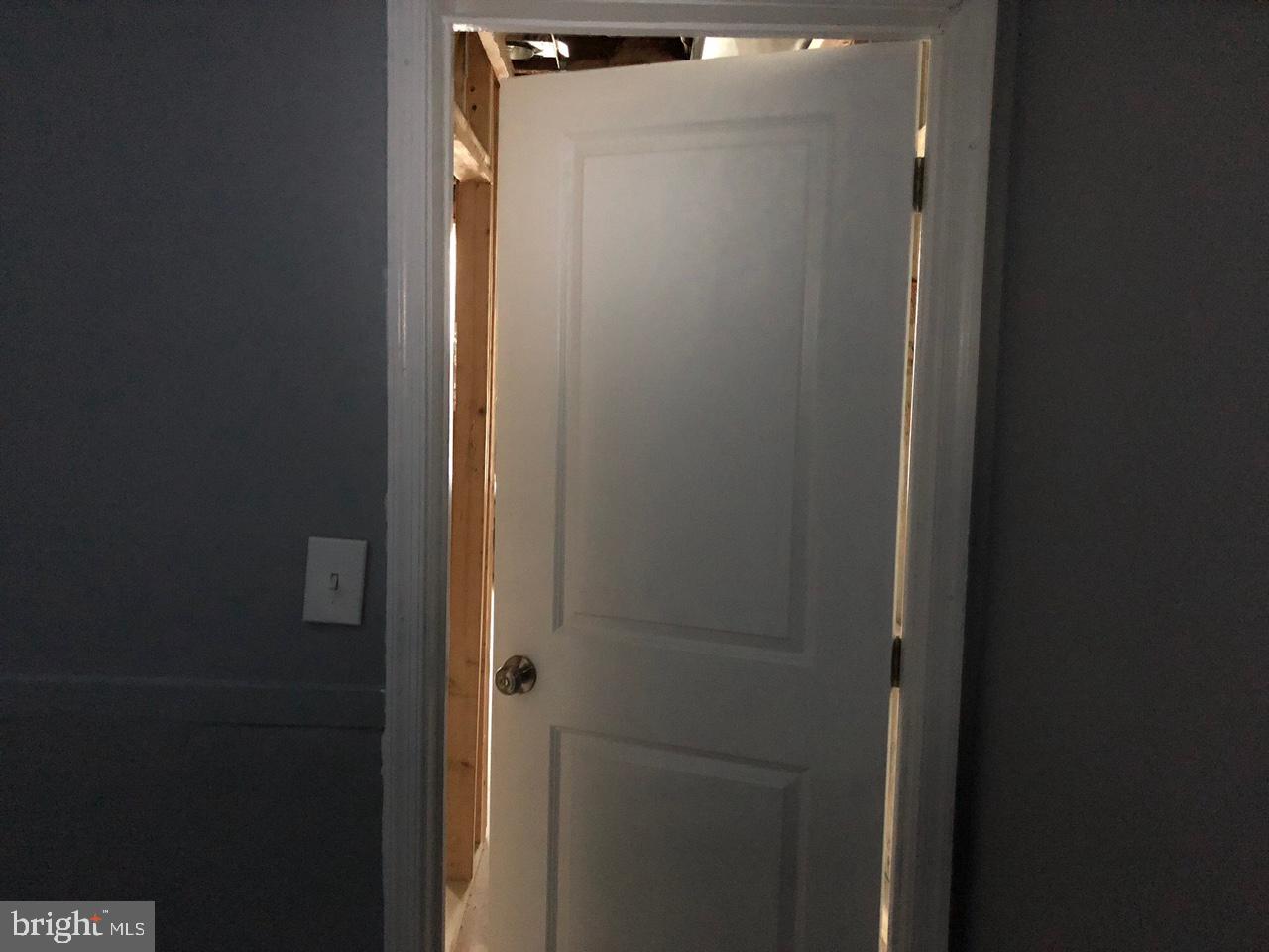 20 North Gilmor Street Baltimore, MD 21223 - Photo 5 of 15 a bathroom with a glass shower door