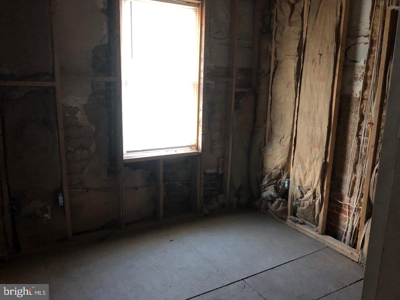 20 North Gilmor Street Baltimore, MD 21223 - Photo 9 of 15 a view of an empty room with a window