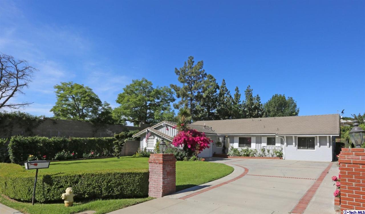 1023 North Old Ranch Road Arcadia, CA 91006 - Photo 1 of 32 a front view of a house with a yard
