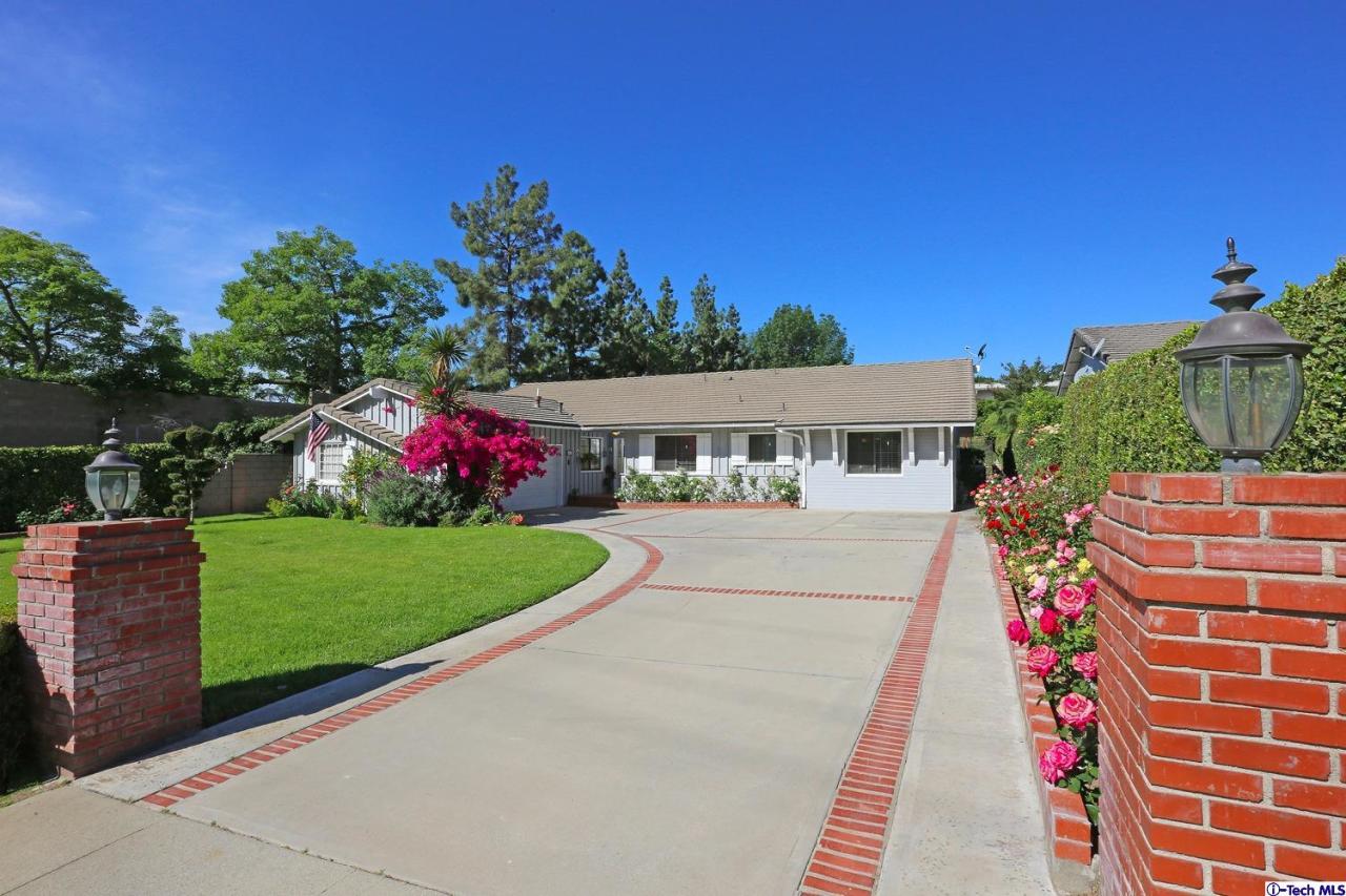 1023 North Old Ranch Road Arcadia, CA 91006 - Photo 2 of 32 a front view of a house with a yard