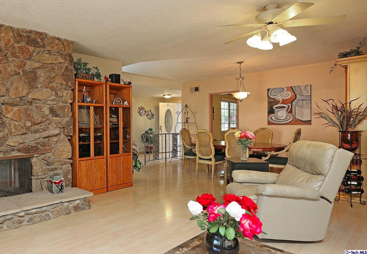 1023 North Old Ranch Road Arcadia, CA 91006 - Photo 11 of 32 a living room with furniture flowers and a chandelier