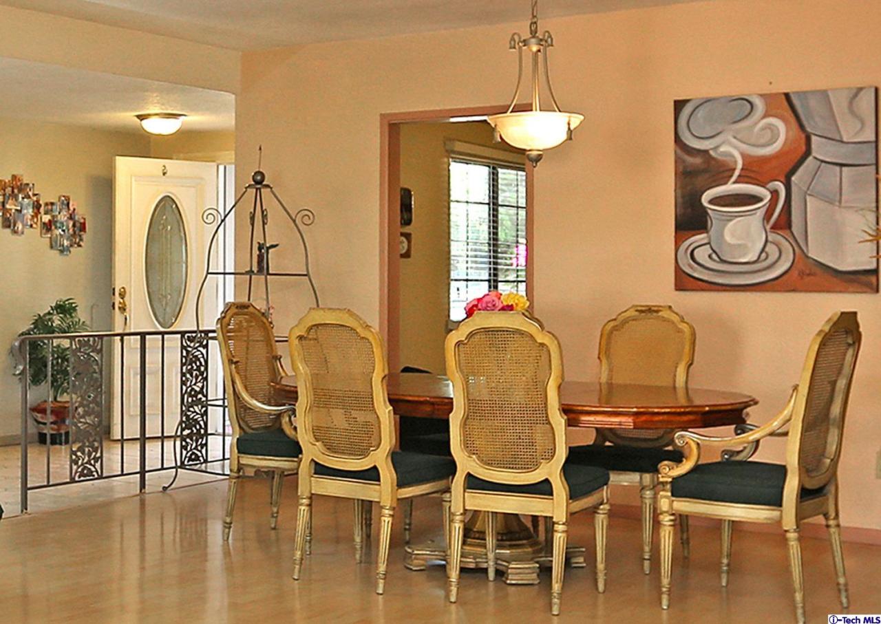 1023 North Old Ranch Road Arcadia, CA 91006 - Photo 12 of 32 a dining room with furniture and wooden floor