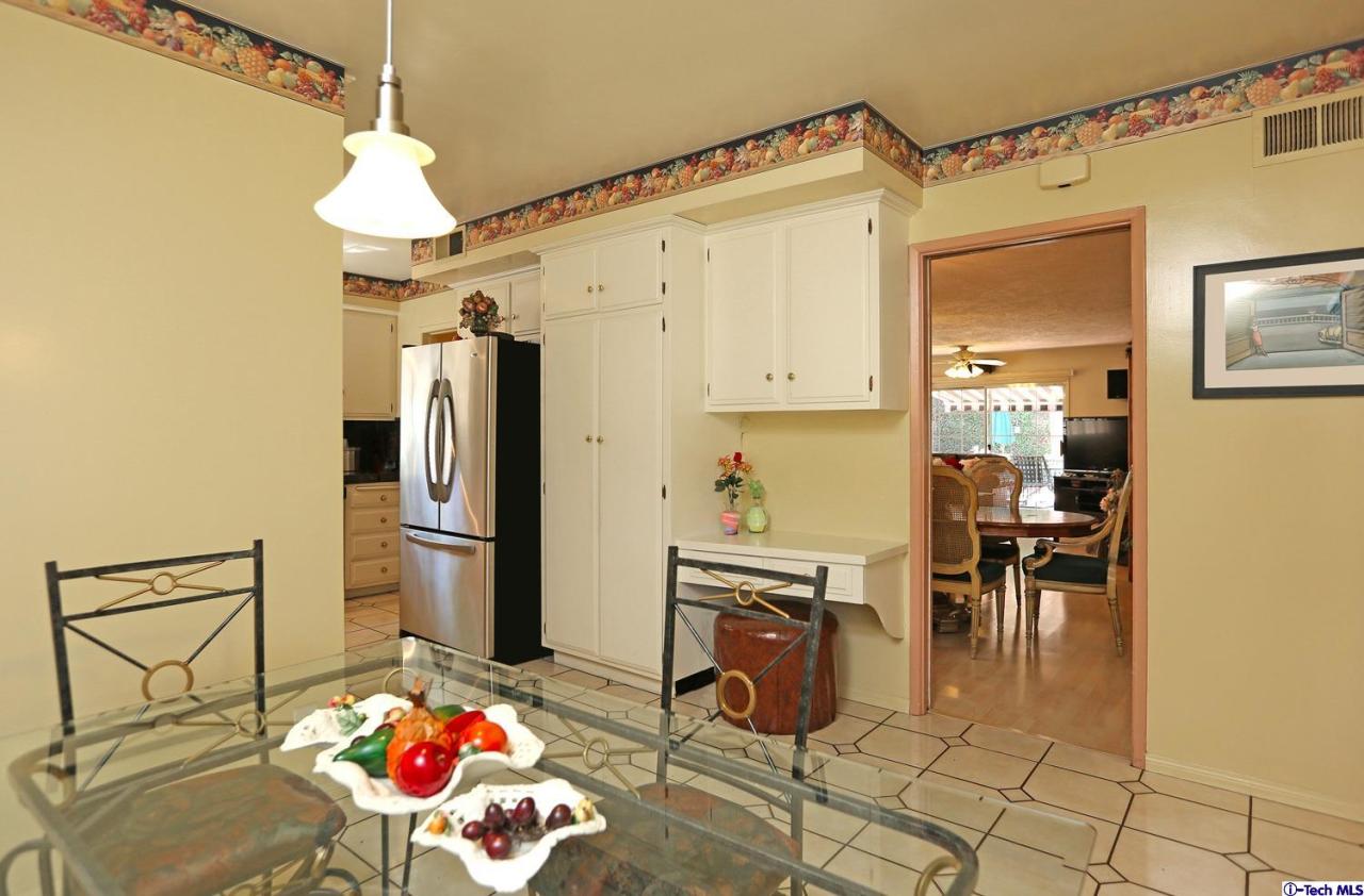 1023 North Old Ranch Road Arcadia, CA 91006 - Photo 16 of 32 a kitchen with stainless steel appliances kitchen island granite countertop a refrigerator and a stove