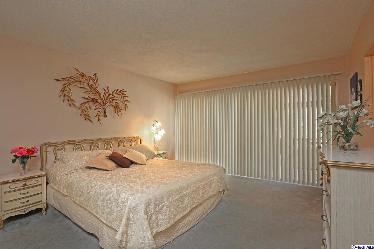 1023 North Old Ranch Road Arcadia, CA 91006 - Photo 18 of 32 a bedroom with a bed and a window