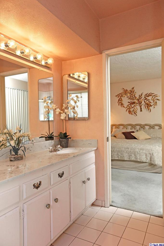 1023 North Old Ranch Road Arcadia, CA 91006 - Photo 19 of 32 a bathroom with a double vanity sink and a mirror