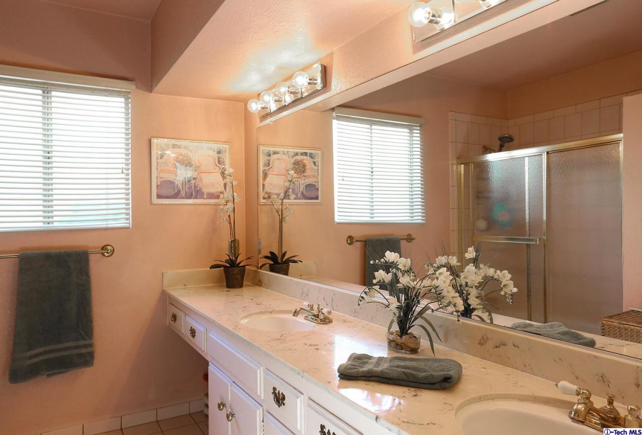 1023 North Old Ranch Road Arcadia, CA 91006 - Photo 20 of 32 a bathroom with a sink double vanity and a mirror