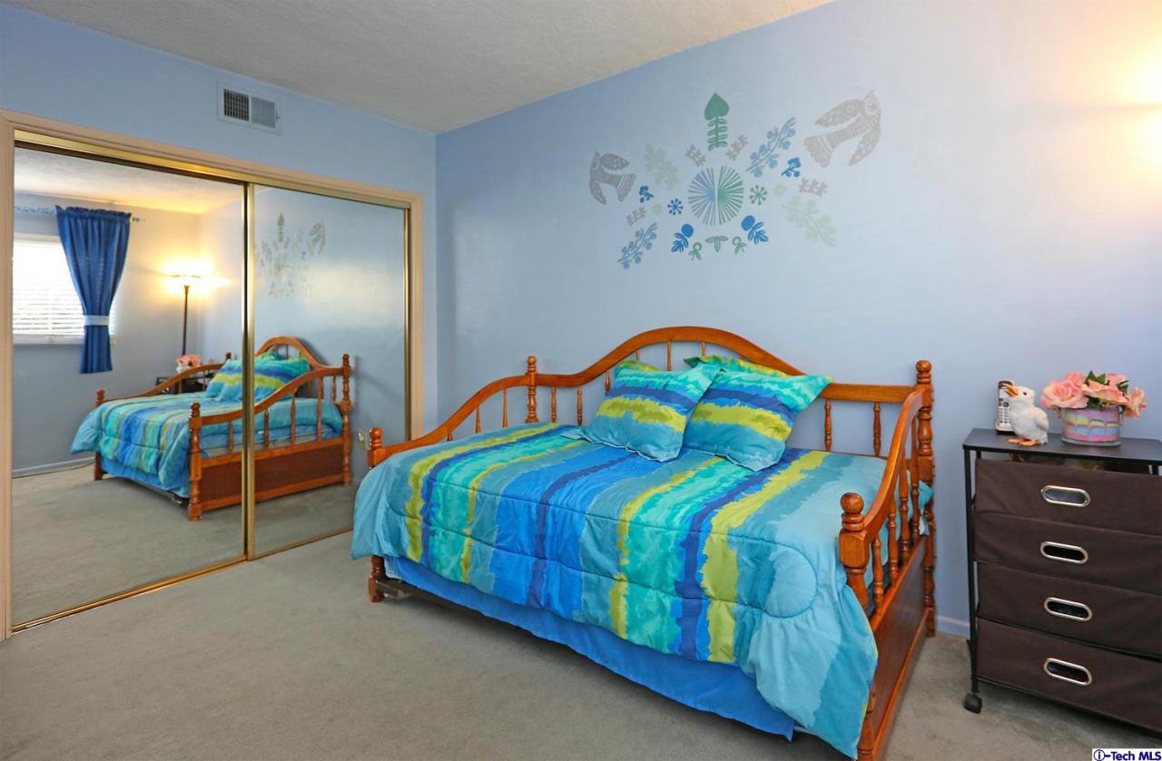 1023 North Old Ranch Road Arcadia, CA 91006 - Photo 21 of 32 a bedroom with a bed and a painting on the wall