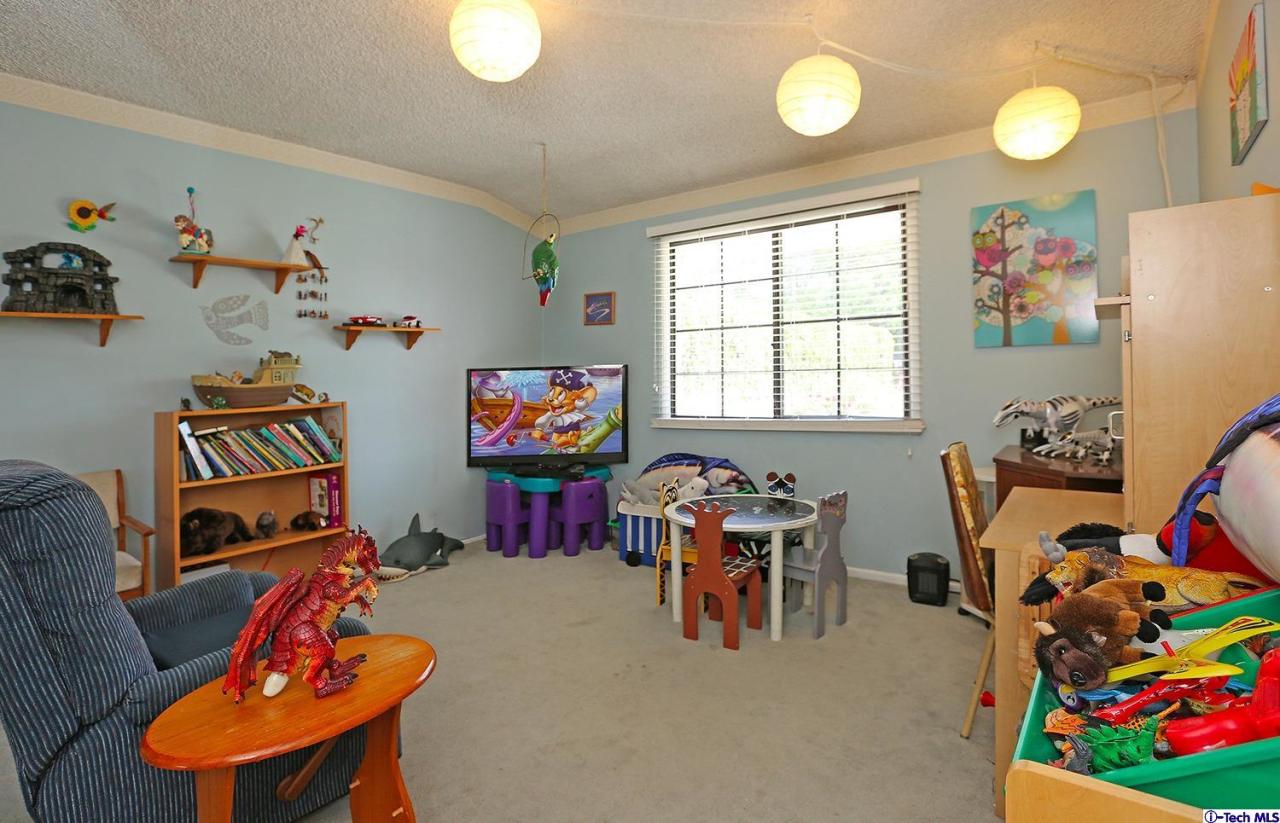 1023 North Old Ranch Road Arcadia, CA 91006 - Photo 22 of 32 a living room with furniture and a window