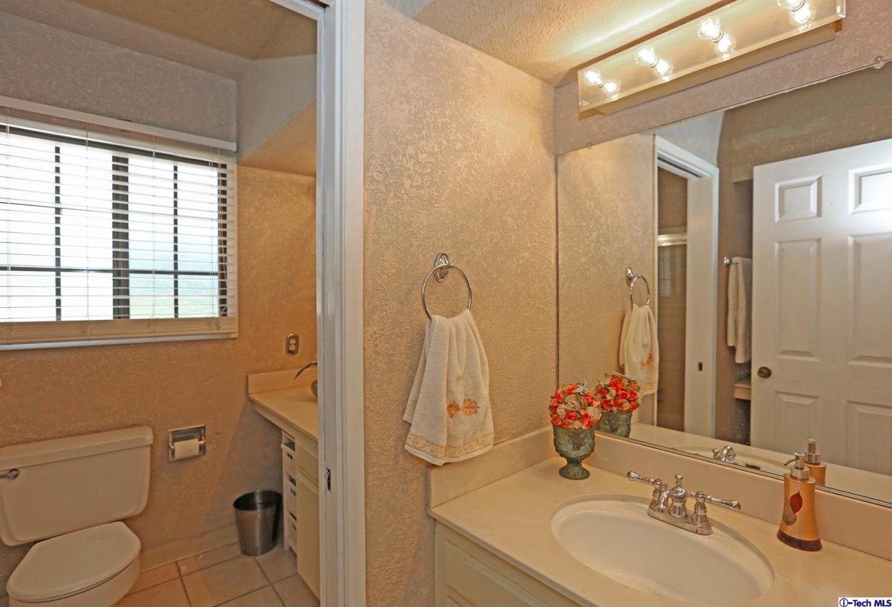 1023 North Old Ranch Road Arcadia, CA 91006 - Photo 23 of 32 a bathroom with a sink toilet and shower