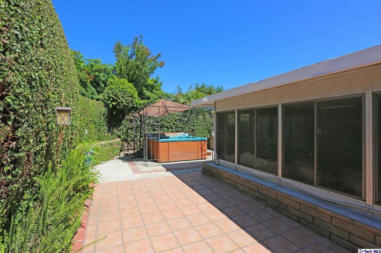1023 North Old Ranch Road Arcadia, CA 91006 - Photo 31 of 32 a view of a house with a yard