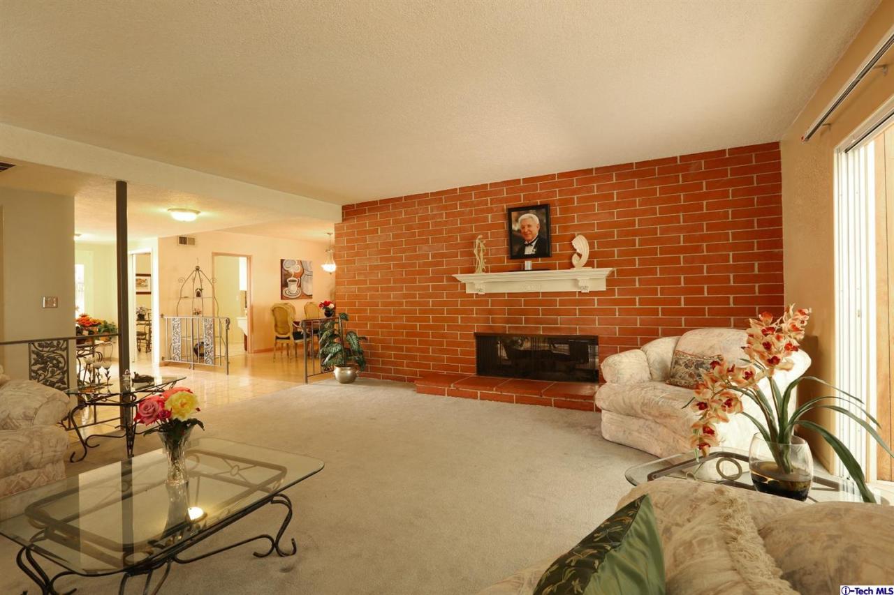 1023 North Old Ranch Road Arcadia, CA 91006 - Photo 6 of 32 a view of a livingroom with furniture and a fireplace