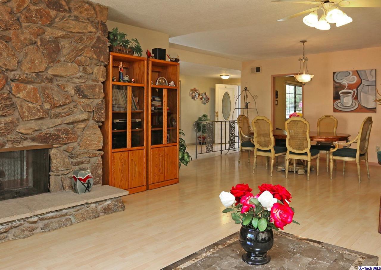 1023 North Old Ranch Road Arcadia, CA 91006 - Photo 8 of 32 a living room with furniture a chandelier