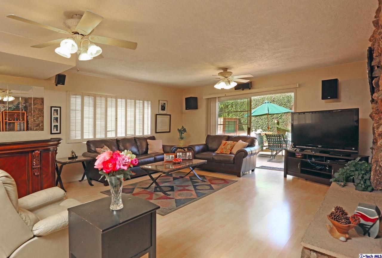 1023 North Old Ranch Road Arcadia, CA 91006 - Photo 9 of 32 a living room with furniture chandelier and a flat screen tv