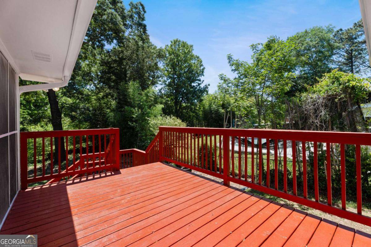 865 Old Tucker Road Stone Mountain, GA 30087 - Photo 42 of 57 a balcony with wooden floor in front of house