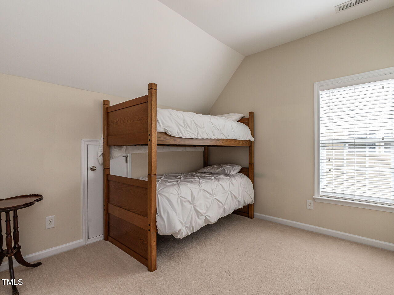 1028 Dotson Way Apex, NC 27523 - Photo 21 of 52 a bedroom with a bed and a window