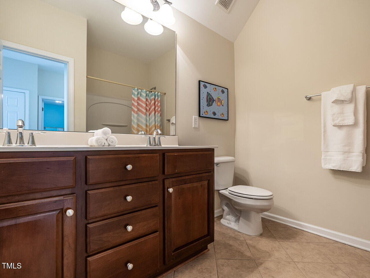 1028 Dotson Way Apex, NC 27523 - Photo 22 of 52 a bathroom with a toilet a sink and mirror