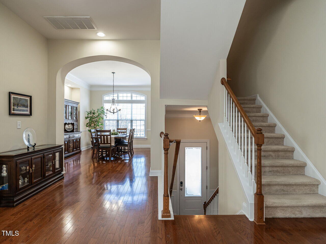 1028 Dotson Way Apex, NC 27523 - Photo 3 of 52 a view of entryway and hall with wooden floor