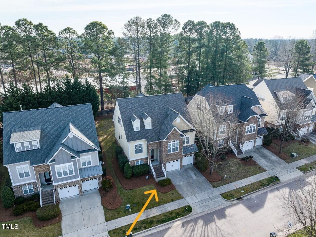 1028 Dotson Way Apex, NC 27523 - Photo 47 of 52 an aerial view of a house with garden space and street view