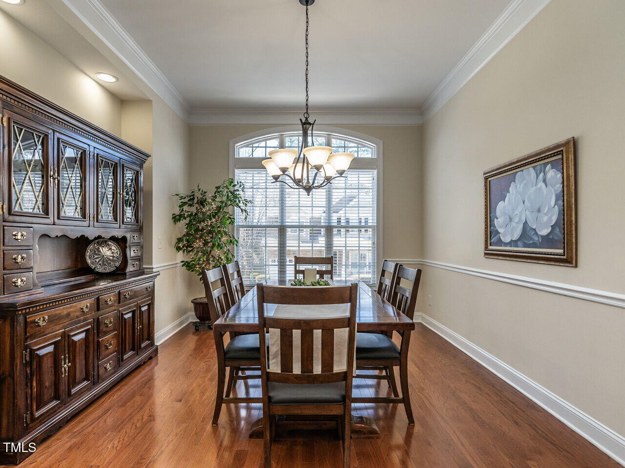 1028 Dotson Way Apex, NC 27523 - Photo 5 of 52 a view of a dining room with furniture window and wooden floor