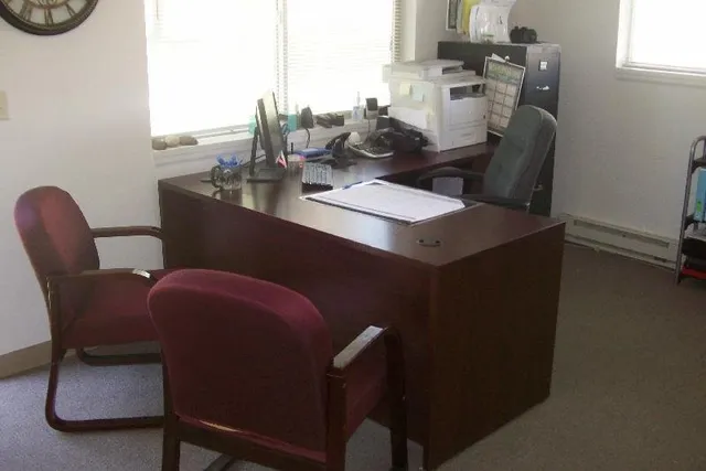 a dining room with furniture and window