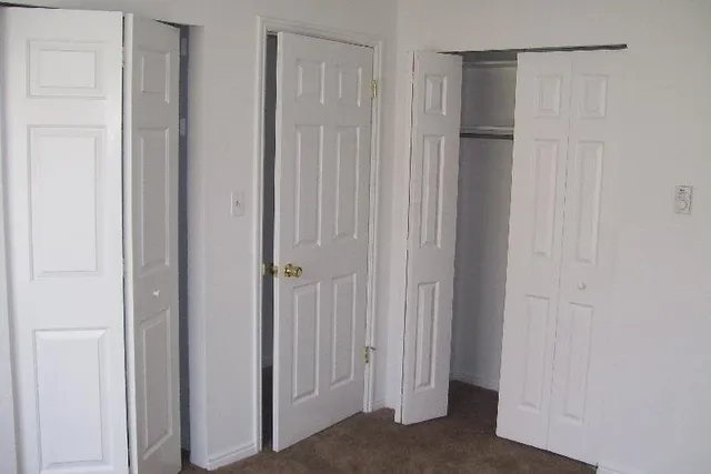 a kitchen with granite countertop a stove and a cabinets