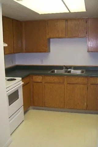 a bathroom with a shower a toilet and a sink