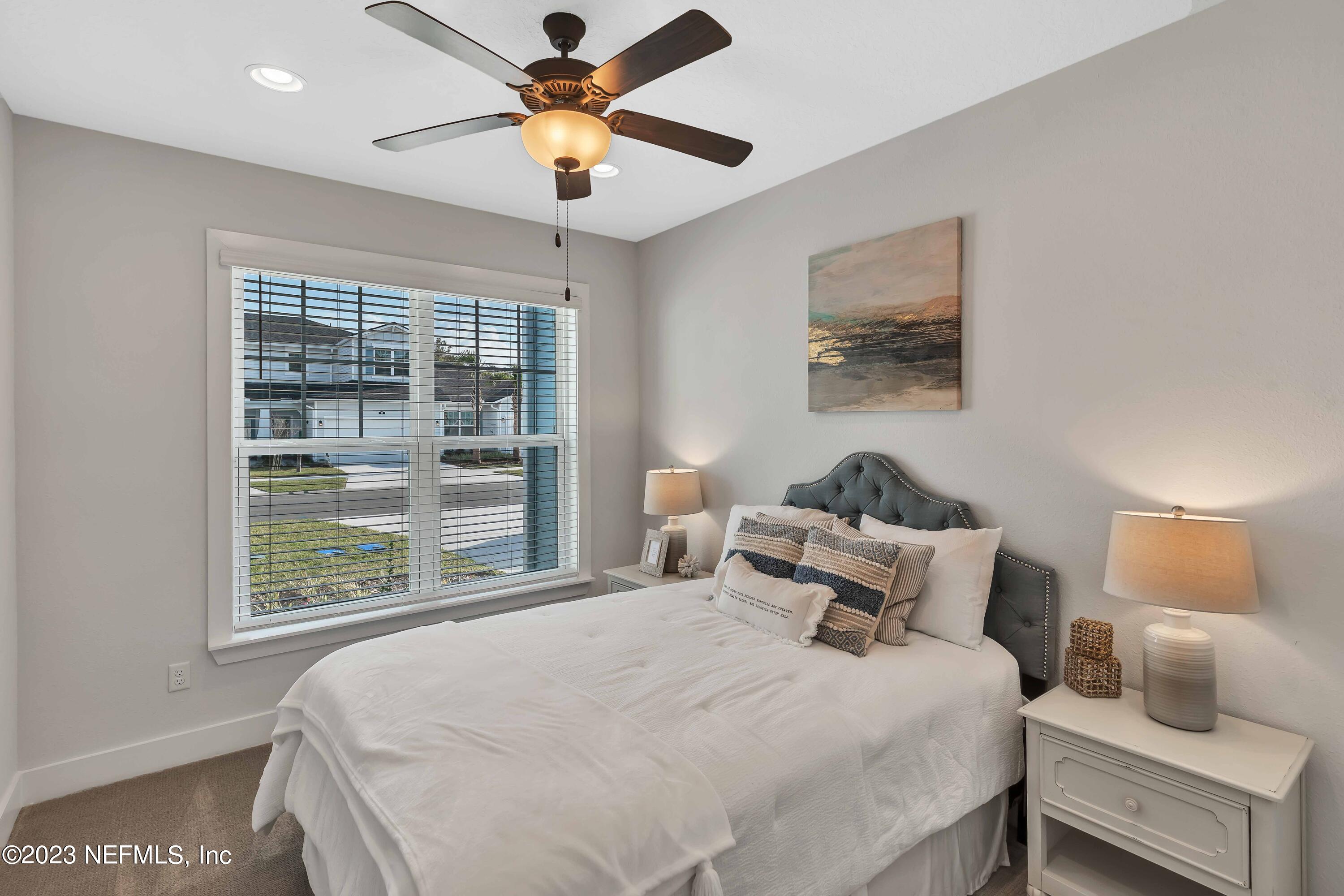 417 Cherry Elm Drive, Unit 73 St. Augustine, FL 32092 - Photo 14 of 29 a bedroom with a bed and a window