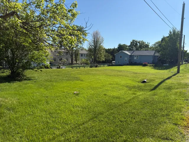 a backyard of a house with lots of green space
