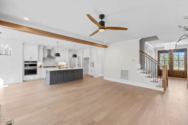 a view of kitchen with furniture and a ceiling fan