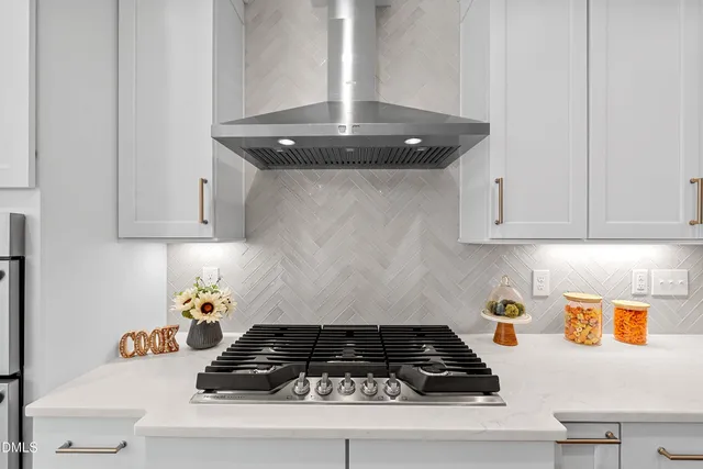 a kitchen with a stove and cabinets