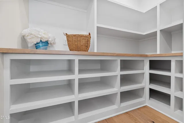 a view of a kitchen sink and cabinets