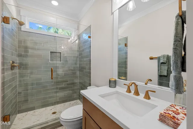 an empty room with a window and a ceiling fan