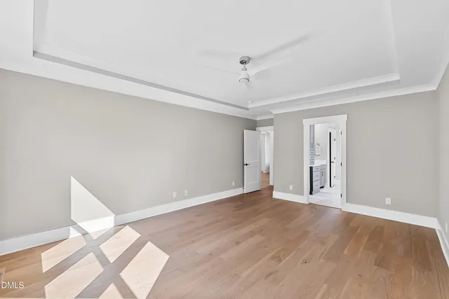a spacious bathroom with a double vanity sink a mirror and a bathtub