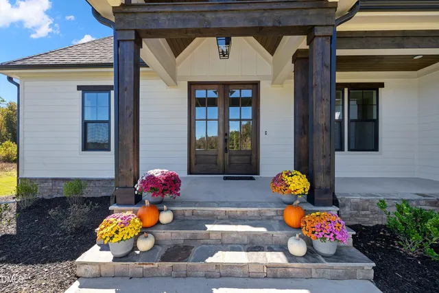 a front view of a house with outdoor seating
