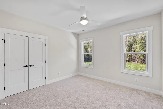a view of a hallway with a window